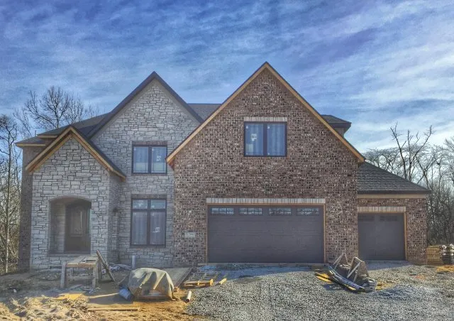New brown garage door system in beautiful house