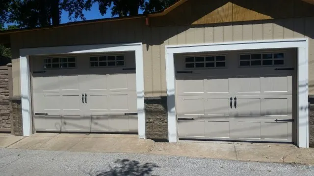 New grey garage doors system in one story house